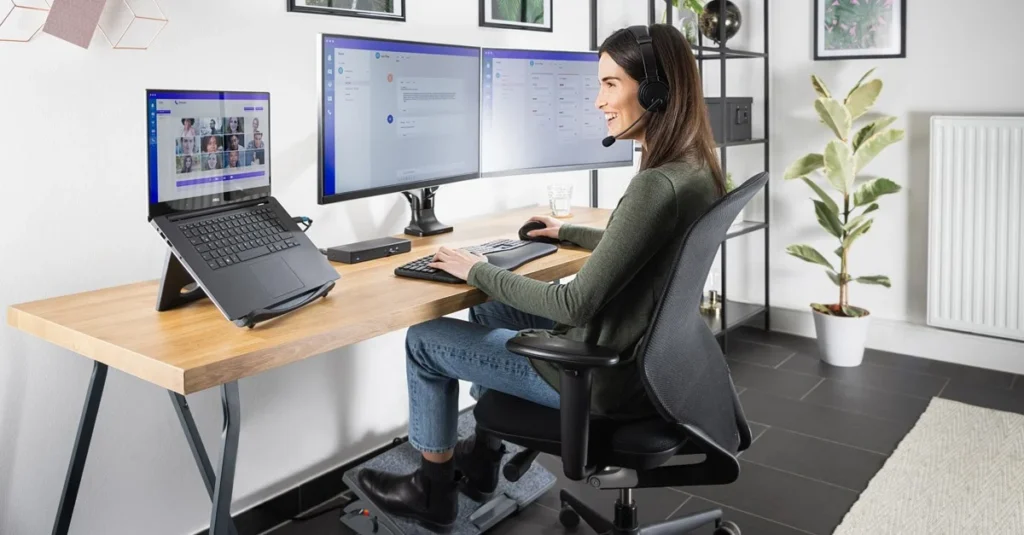 ergonomic home office desk setup with monitor at eye level and proper lighting